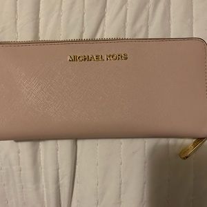 Michael Kors pink zipper wallet.